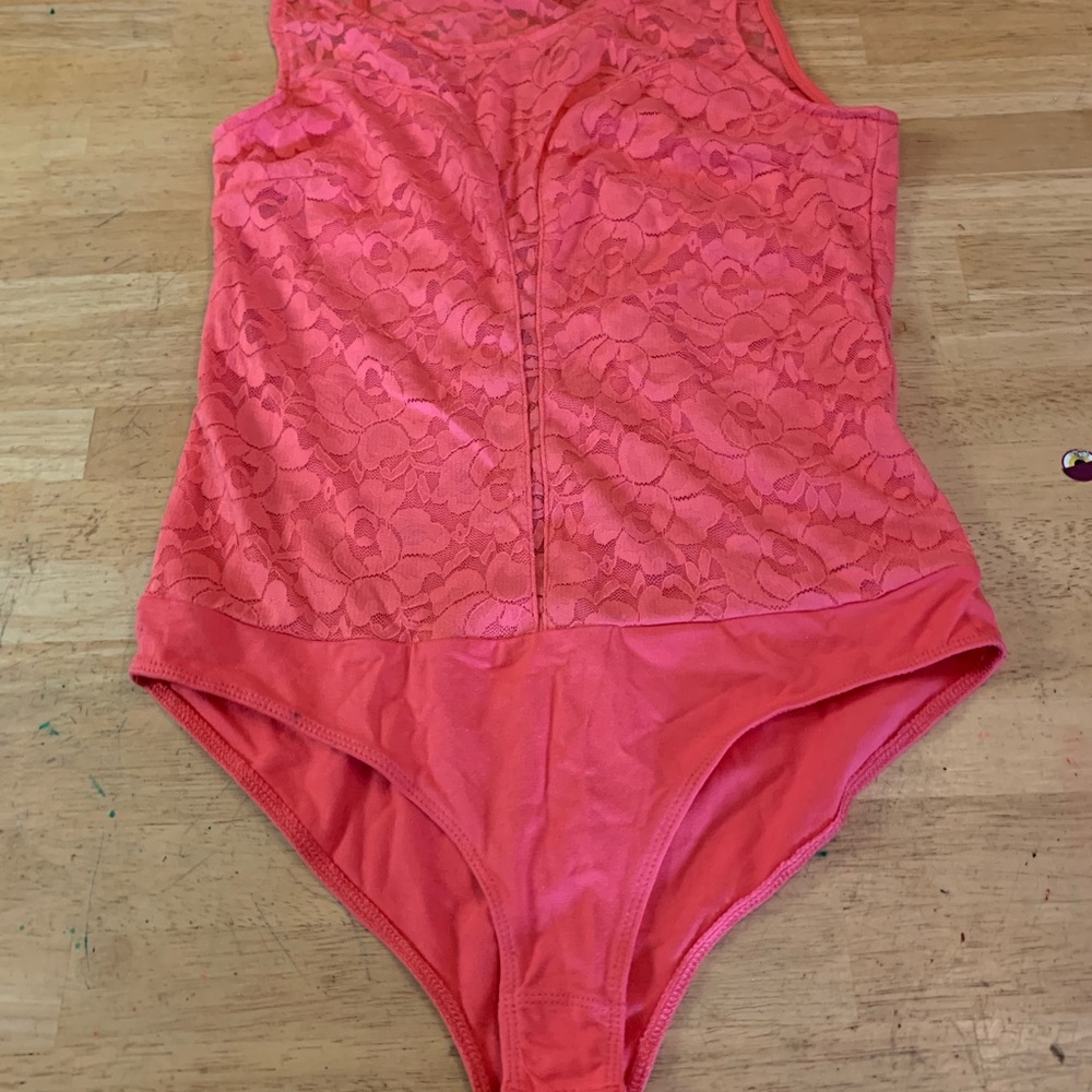 Women’s reddish/pink body suit